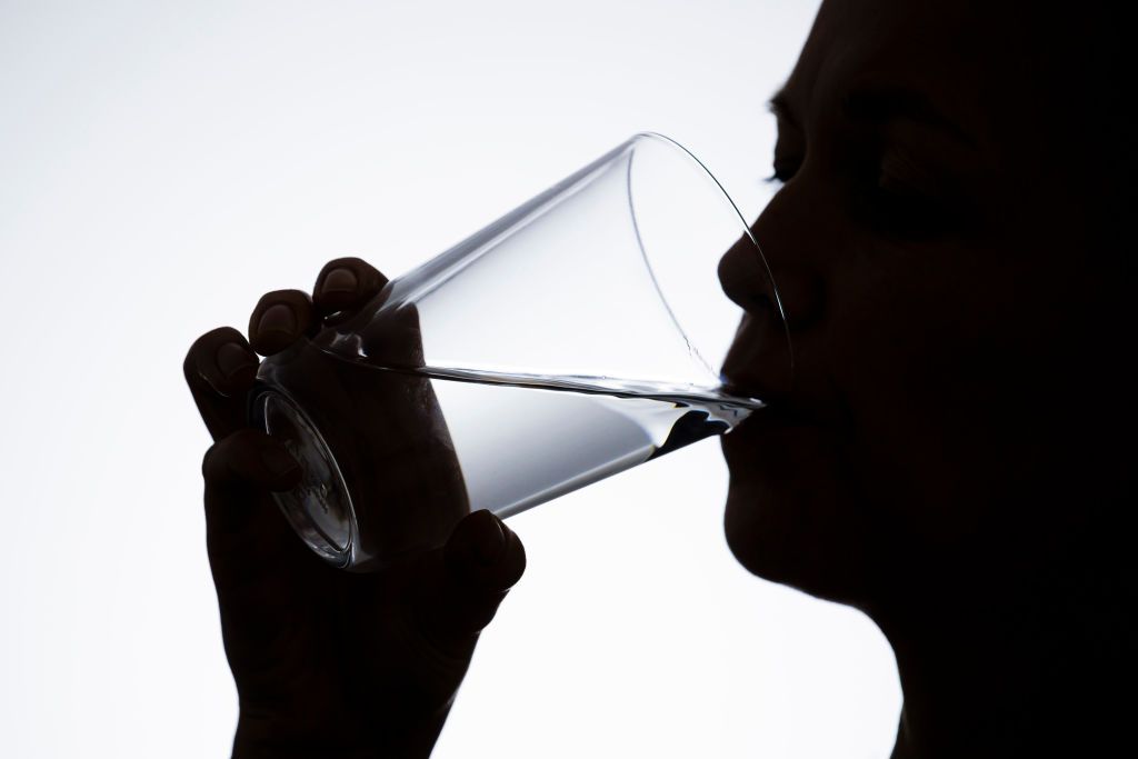 BERLIN, GERMANY - FEBRUARY 20: Symbol photo on the subject of drinking water: a woman drinking water from a glass on February 20, 2020 in Berlin, Germany. (Photo by Thomas Trutschel/Photothek via Getty Images)